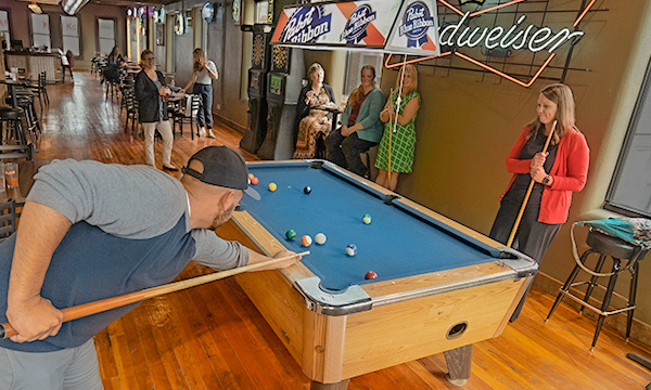 couple playing pool