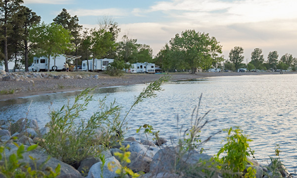 campers parked by the lake shore