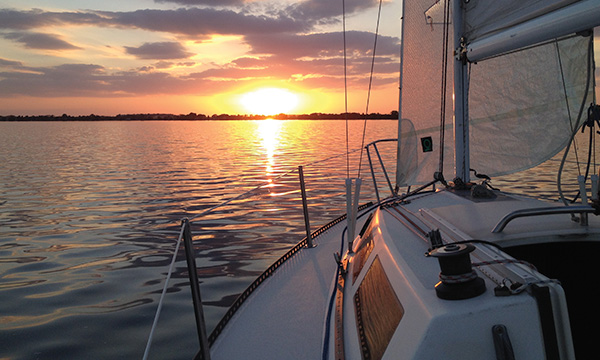 boat at sunset on lake